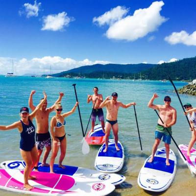 A group having fun in the Whitsundays on SUPS