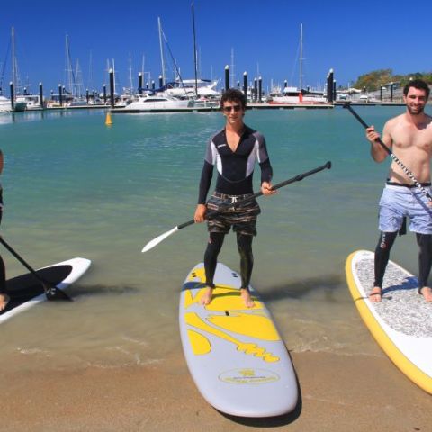 three people enjoying SUPS