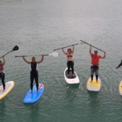 People with paddles over the heads having a great time in the Whitsundays